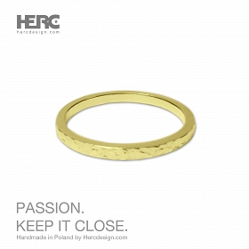 A thin gold ring with a texture